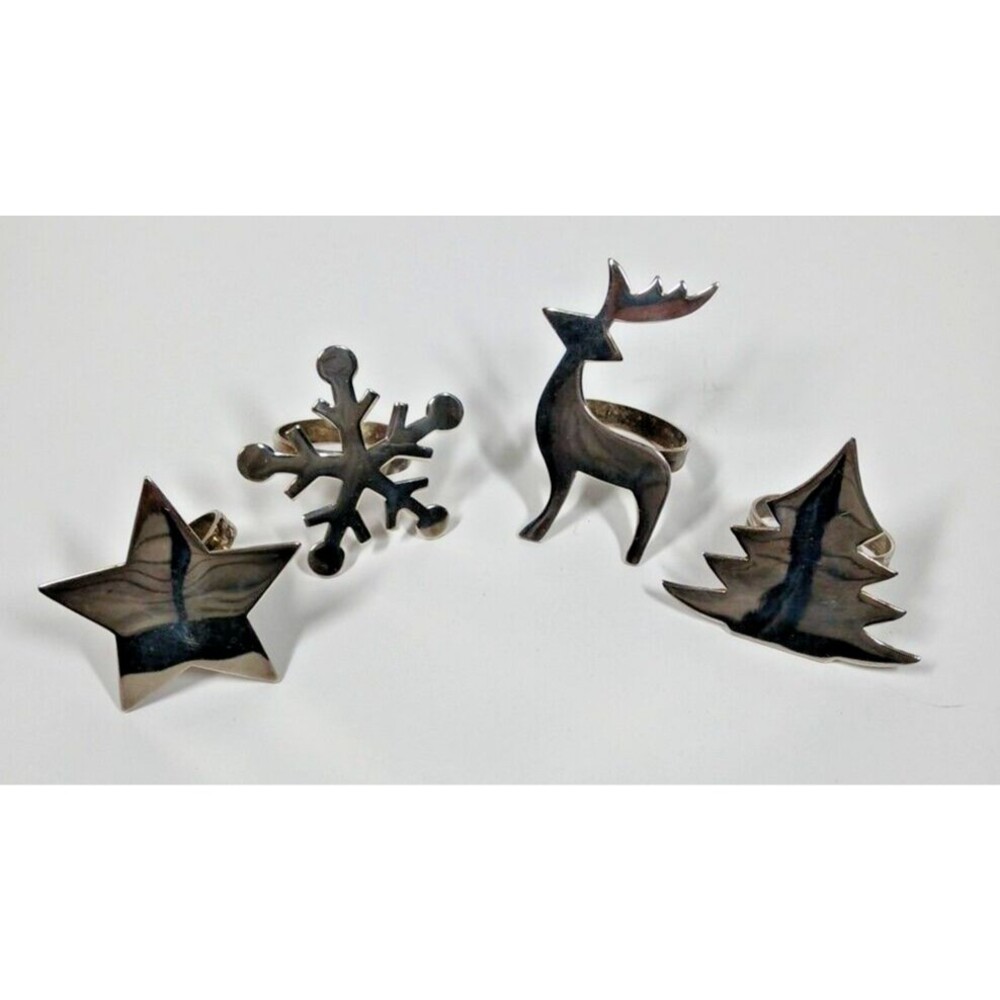 Pier 1 Christmas Silver Plated Napkin Rings Set of 4 Star Tree Snowflake Deer